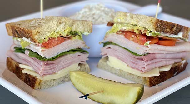 Sandwich on a plate with pickle